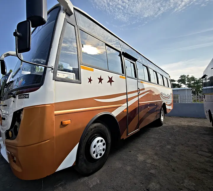 White and copper 3 Star tourist coach with three stars on its side