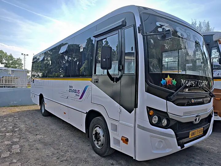 White Tata Starbus mini coach with Tourist Coach lettering